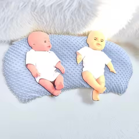 Coussin double avec rebords anti-régurgitation